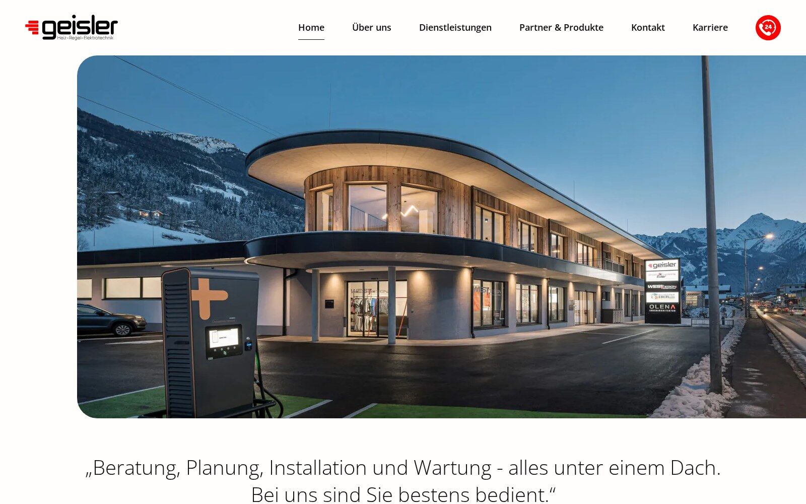 Startseite von Geisler mit Firmengebäude in der Dämmerung